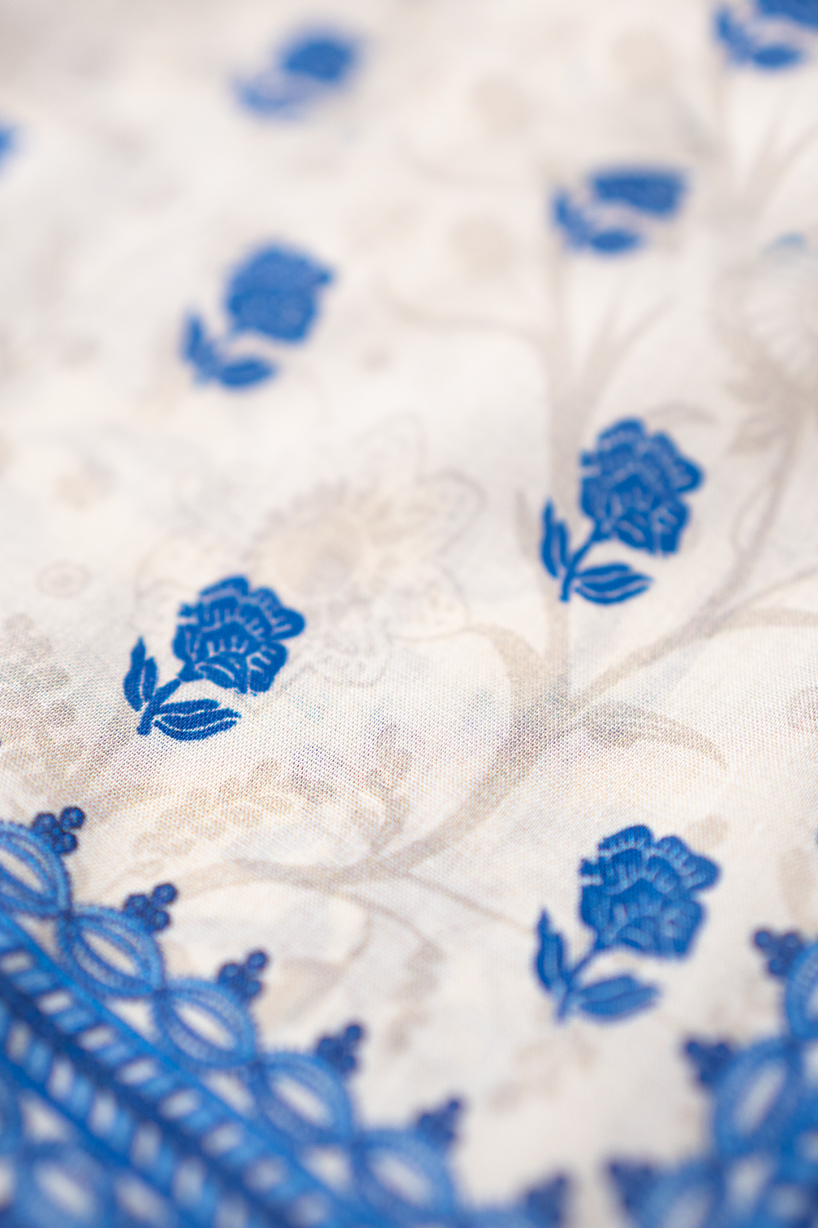 Azure Bloom white and royal blue luxury eid pret by Eviline Couture with lacework and embellished neckline