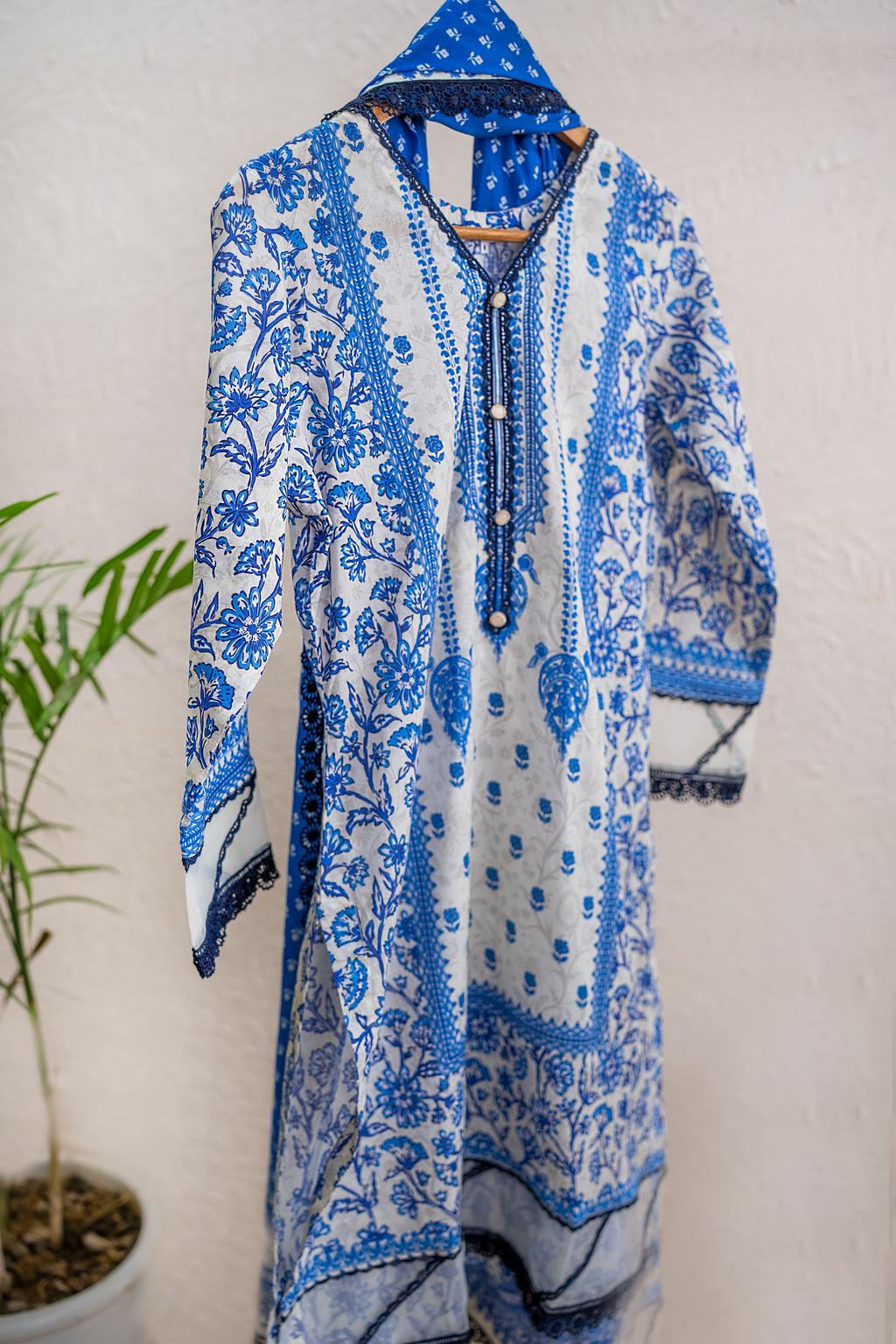 Azure Bloom white and royal blue luxury eid pret by Eviline Couture with lacework and embellished neckline