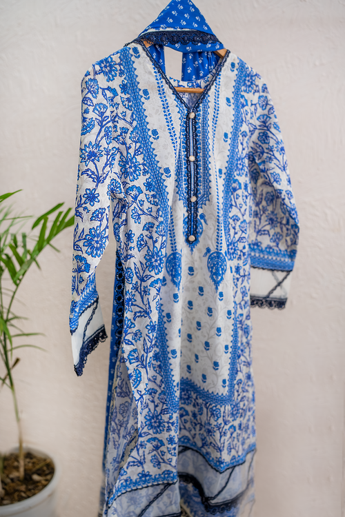Azure Bloom white and royal blue luxury eid pret by Eviline Couture with lacework and embellished neckline