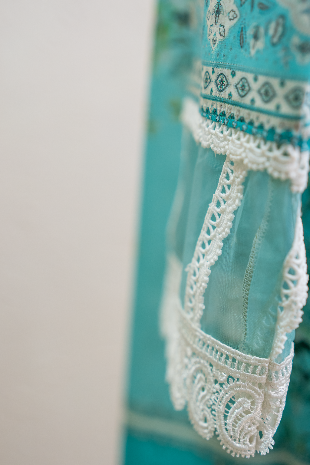 Premium cyan lawn fabric with tonal botanical print