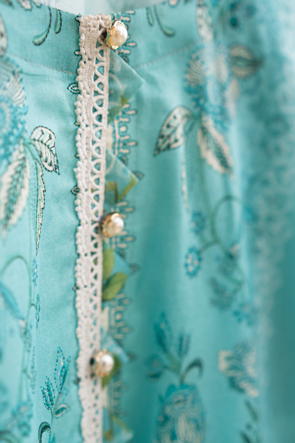 Embellished lacework neckline detail of cyan festive pret outfit