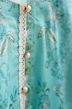 Embellished lacework neckline detail of cyan festive pret outfit