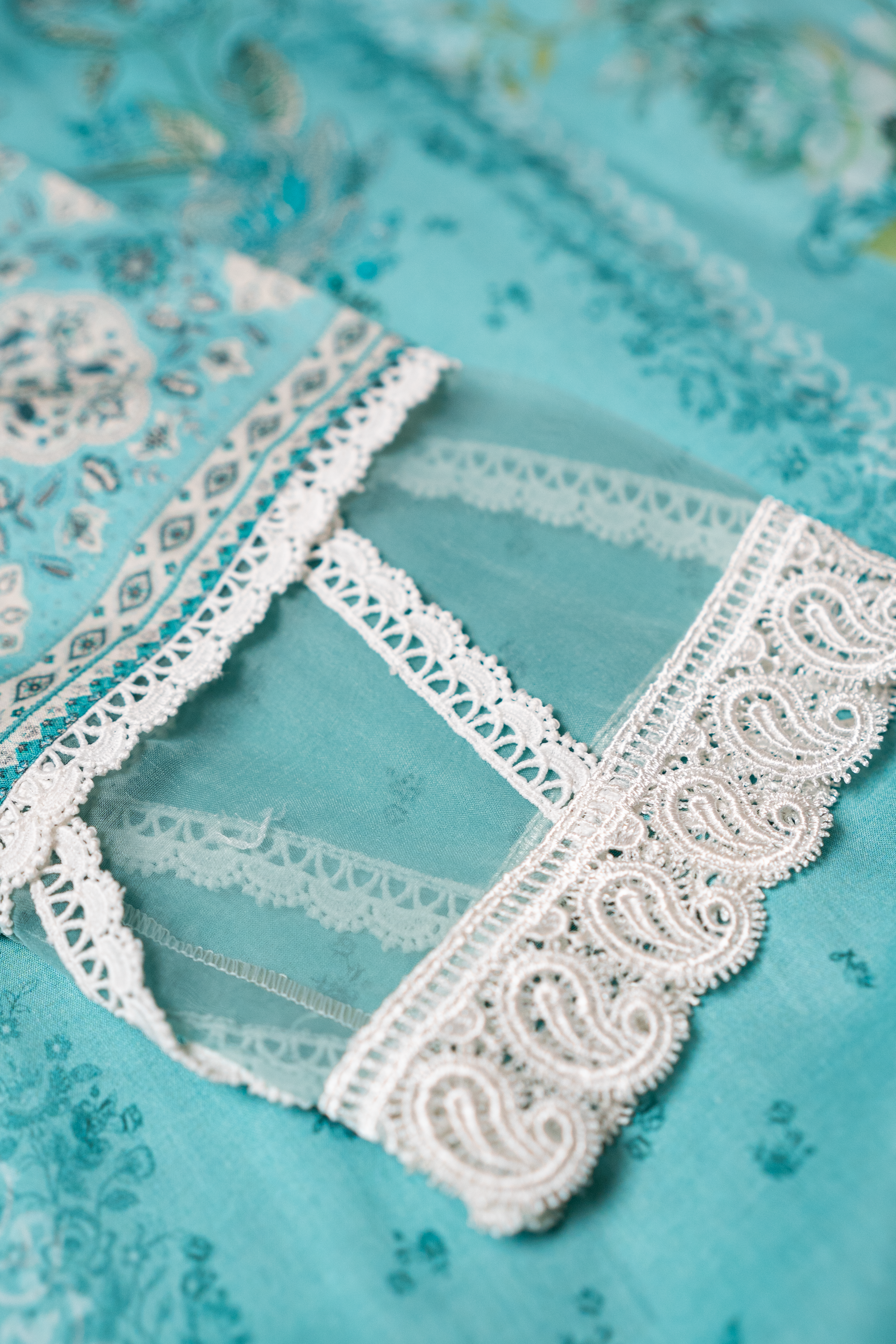 Cyan lawn sleeve with intricate lace finishing