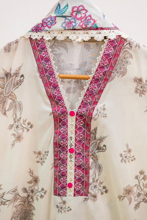 Embellished lacework neckline detail of offwhite festive pret outfit