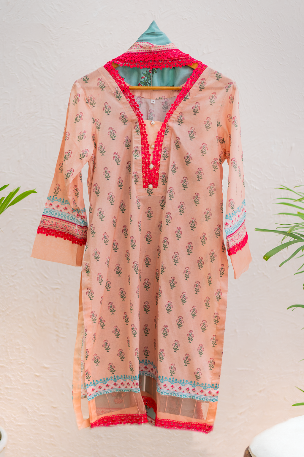 Rosé Flare peach luxury Eid pret by Eviline Couture with contrast lace detailing and floral print