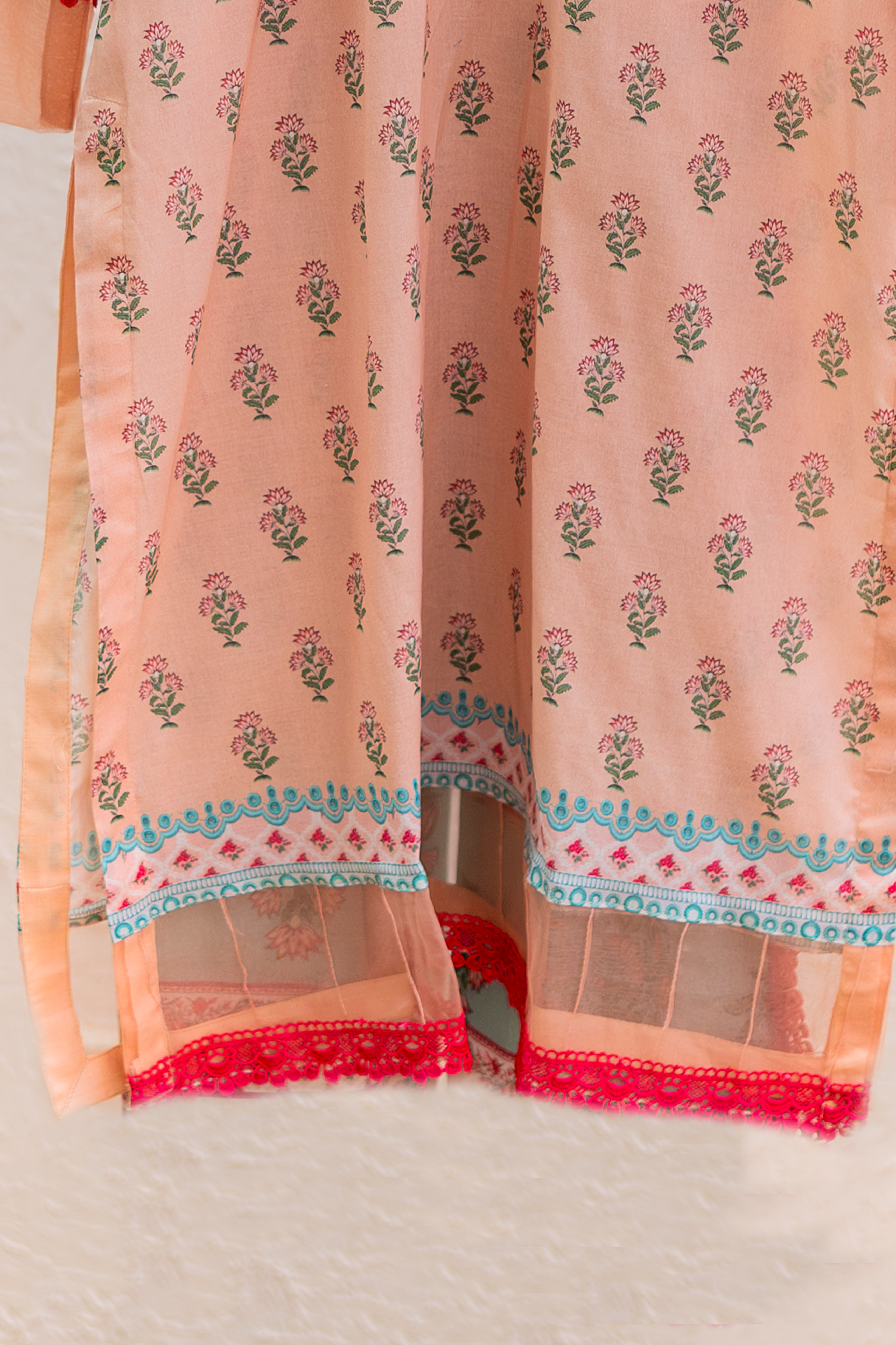 Contrast lace border on peach Eid pret daman