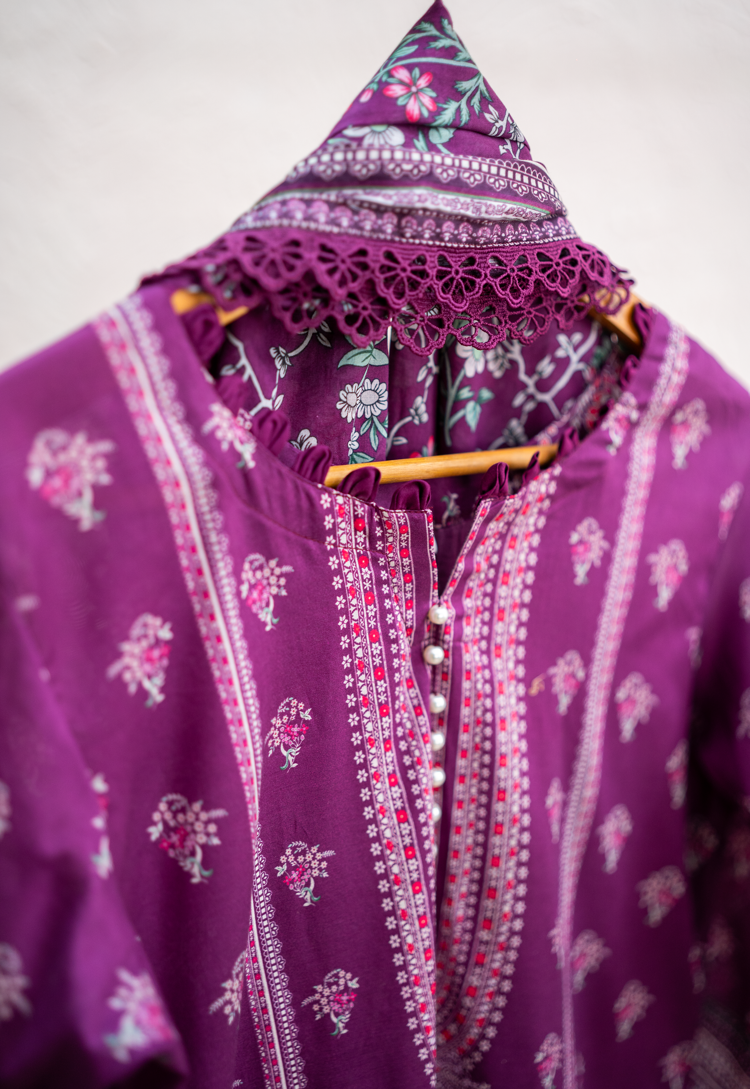 Embellished lace neckline detail in deep purple festive outfit
